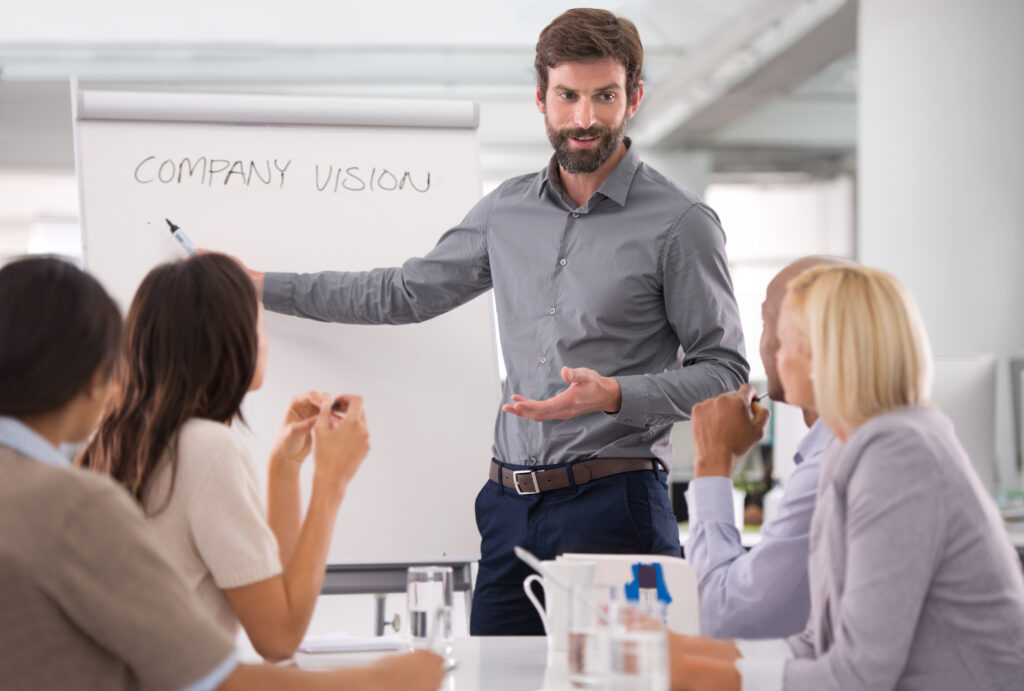 man presenting with paper board