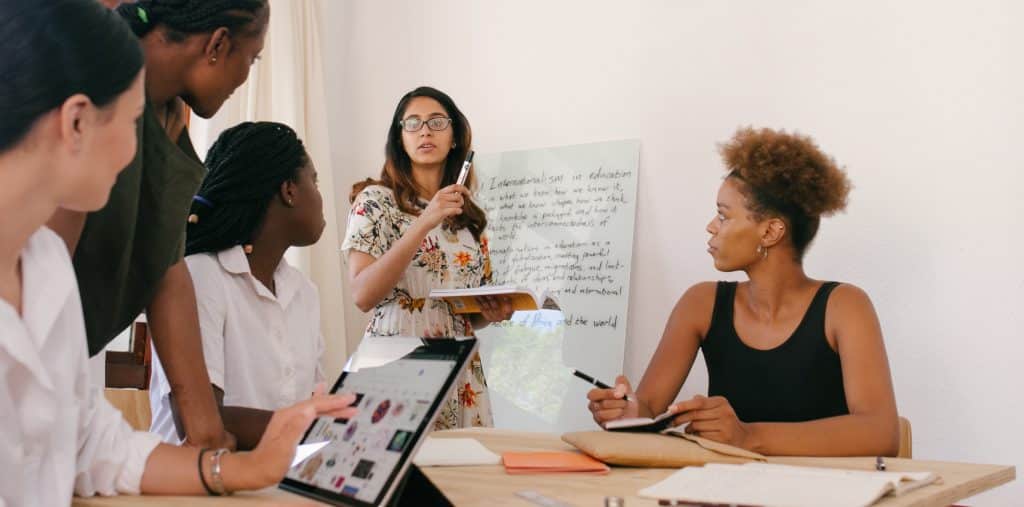 women in business meeting leadership qualities