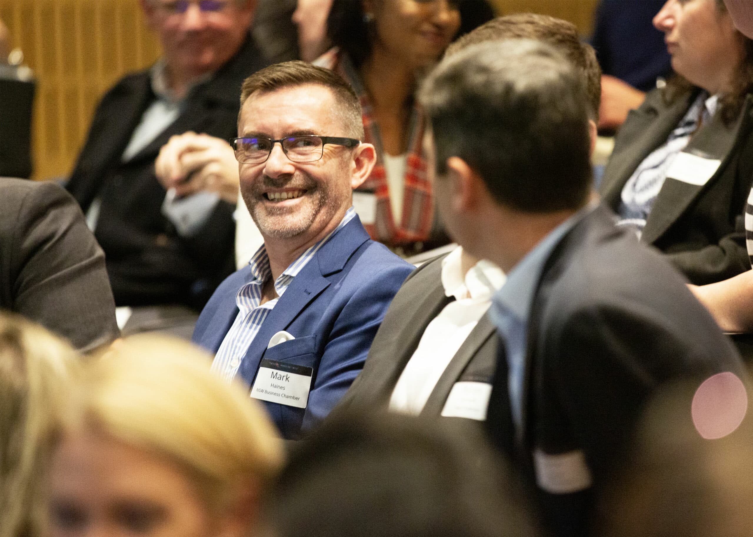 Man smiling in conversation