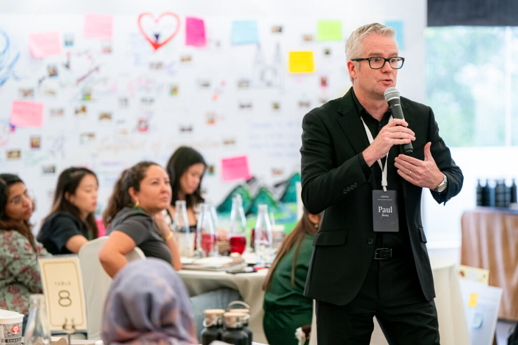 Paul Bindig CJM Facilitatorpresenting with mic